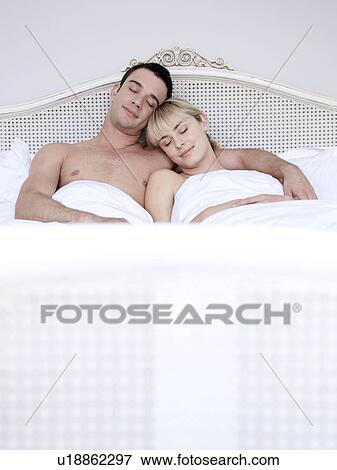 Man and woman in bed View Large Photo Image Stock Photo - Man and woman in bed. Fotosearch