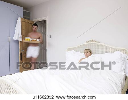 Man and woman in bedroom View Large Photo Image Stock Image - Man and woman in bedroom. Fotosearch