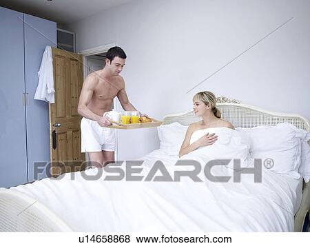 Man and woman in bedroom View Large Photo Image Stock Photo - Man and woman in bedroom. Fotosearch