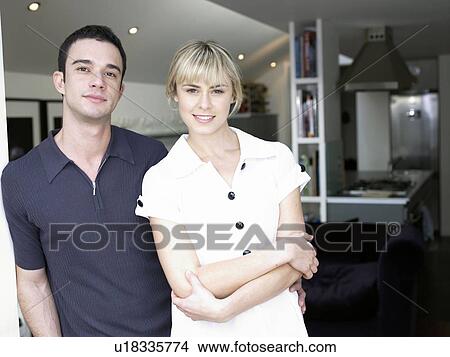 Man and woman in kitchen facing camera View Large Photo Image Picture - Man and woman in kitchen facing camera. Fotosearch