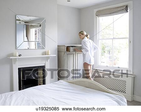 Woman in bedroom View Large Photo Image Stock Photography - Woman in bedroom. Fotosearch
