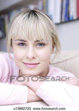 Young woman head on hands to camera View Large Photo Image Stock Photography - Young woman head on hands to camera. Fotosearch