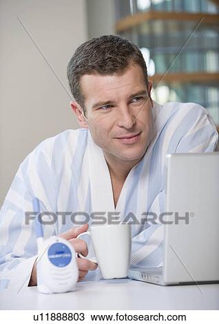 A father working from home View Large Photo Image Stock Image - A father working from home. Fotosearch