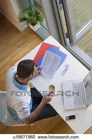 A man working from home View Large Photo Image Stock Image - A man working from home. Fotosearch