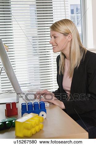 A woman working from home View Large Photo Image Stock Image - A woman working from home. Fotosearch