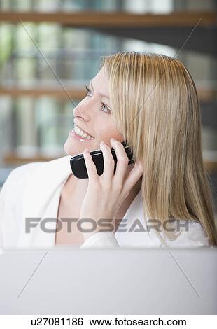 Female on her mobile phone View Large Photo Image Stock Photograph - Female on her mobile phone. Fotosearch