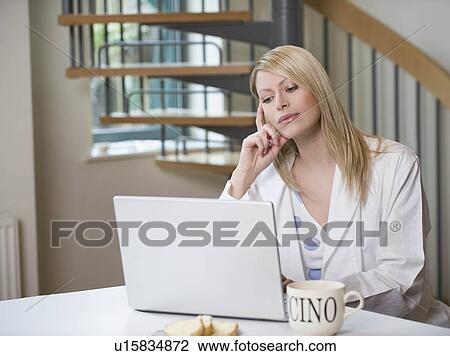 Stock Image - Female working in the morning. Fotosearch