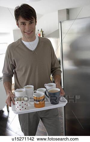 Man carrying tray of drinks View Large Photo Image Stock Image - Man carrying tray of drinks. Fotosearch