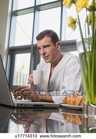 Portrait of a male at his laptop View Large Photo Image Stock Image - Portrait of a male at his laptop. Fotosearch