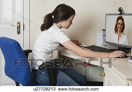 Teenage girl talking to mother on skype View Large Photo Image Stock Image - Teenage girl talking to mother on skype. Fotosearch