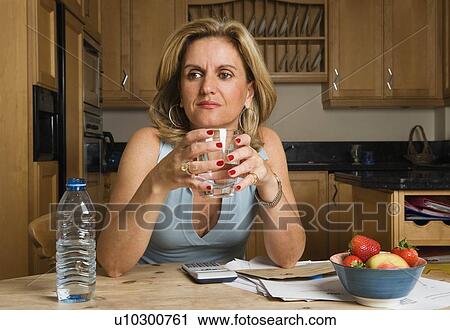 Woman holding glass of water View Large Photo Image Stock Image - Woman holding glass of water. Fotosearch