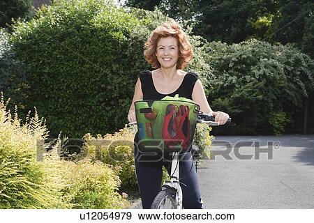 Stock Photo - Woman on bicycle. Fotosearch