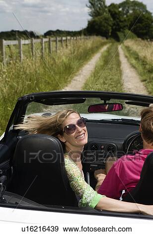 Couple in convertible car View Large Photo Image Stock Photo - Couple in convertible car. Fotosearch