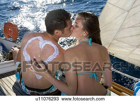 Couple on sailboat, kissing View Large Photo Image Stock Image - Couple on sailboat, kissing. Fotosearch