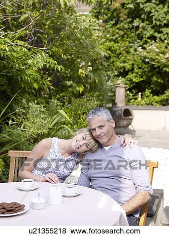 Man and woman having lunch in garden View Large Photo Image Stock Photo - Man and woman having lunch in garden. Fotosearch