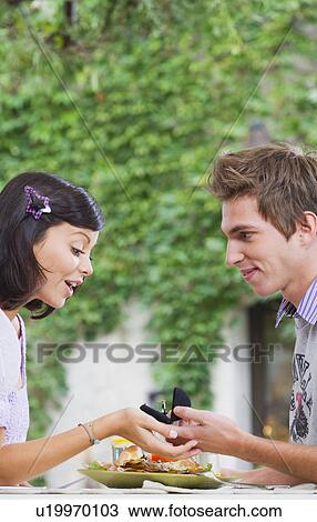 Man proposing to woman. View Large Photo Image Stock Image - Man proposing to woman.. Fotosearch