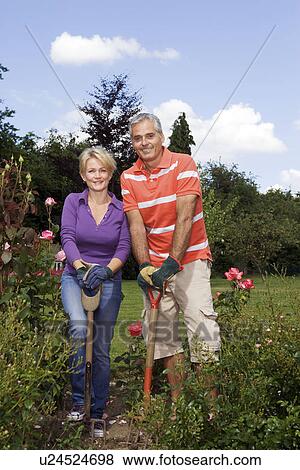 Portrait of couple gardeners View Large Photo Image Stock Photo - Portrait of couple gardeners. Fotosearch