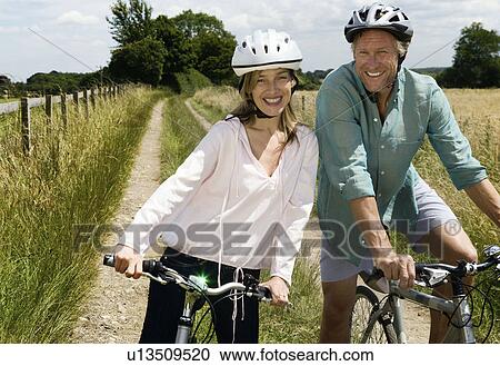 Portrait of male and female cyclist View Large Photo Image Stock Image - Portrait of male and female cyclist. Fotosearch