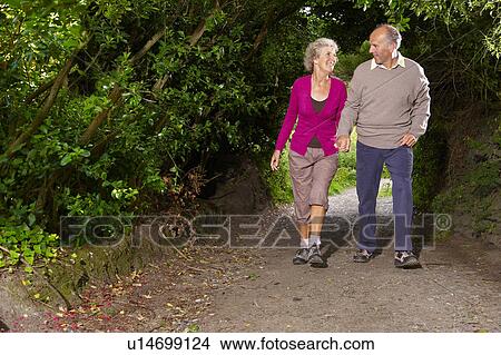 Senior couple walking View Large Photo Image Picture - Senior couple walking. Fotosearch