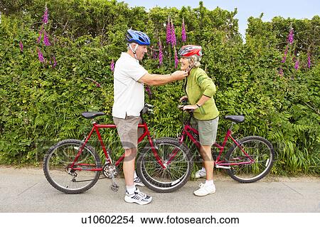 Senior couple with bicycles View Large Photo Image Picture - Senior couple with bicycles. Fotosearch