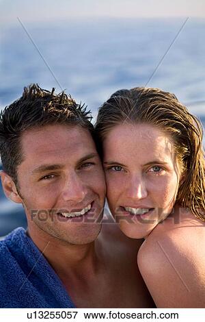 Stock Photo - Young couple portrait at beach. Fotosearch