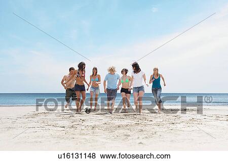 Group playing with ball on beach View Large Photo Image Stock Photo - Group playing with ball on beach. Fotosearch