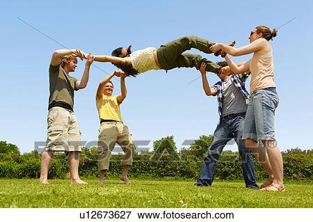 Stock Photo - Group young people playing bumps. Fotosearch