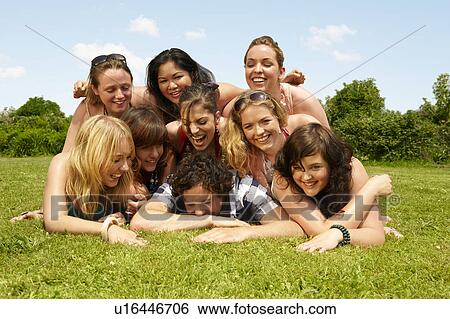 Portrait of a group young people on lawn View Large Photo Image Stock Photograph - Portrait of a group young people on lawn. Fotosearch