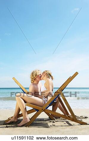 Young couple kissing View Large Photo Image Stock Image - Young couple kissing. Fotosearch