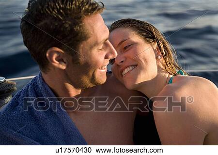 Couple on boat looking at each other View Large Photo Image Stock Image - Couple on boat looking at each other. Fotosearch