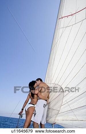 Couple on sail boat, kissing View Large Photo Image Stock Photo - Couple on sail boat, kissing. Fotosearch