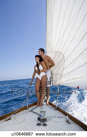 Couple on sailboat View Large Photo Image Stock Photo - Couple on sailboat. Fotosearch