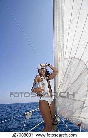 Sexy woman captain of sailboat View Large Photo Image Stock Photo - Sexy woman captain of sailboat. Fotosearch
