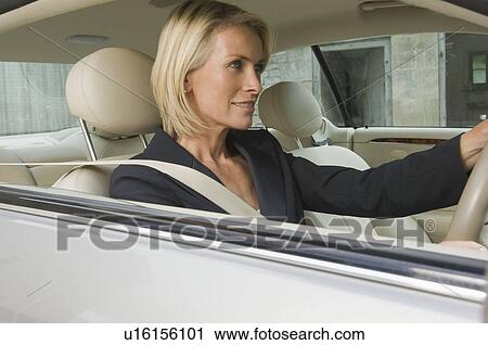 Business woman driving car View Large Photo Image Stock Image - Business woman driving car. Fotosearch