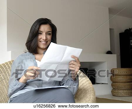 Stock Photograph - Woman reading a letter. Fotosearch