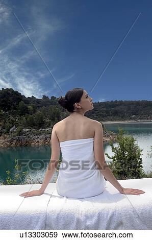 Woman sitting on a table massage View Large Photo Image Stock Photo - Woman sitting on a table massage. Fotosearch