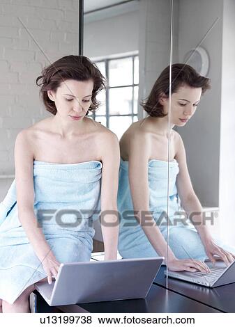 Woman working in sunny home office View Large Photo Image Stock Photo - Woman working in sunny home office. Fotosearch