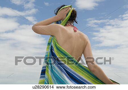 Girl drying her beach hair View Large Photo Image Picture - Girl drying her beach hair. Fotosearch