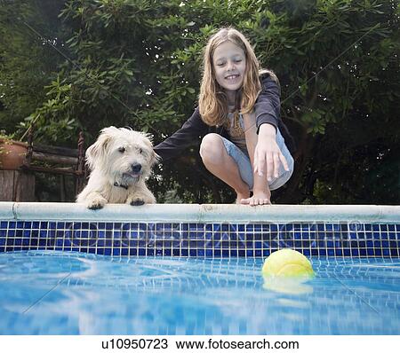 Girl with dog by pool View Large Photo Image Stock Image - Girl with dog by pool. Fotosearch