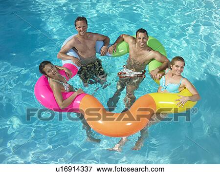 Stock Photo - Group of friends in pool. Fotosearch