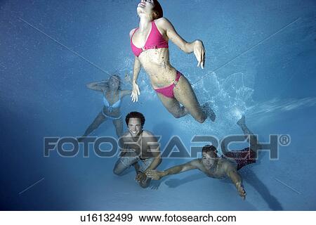 Group swimming underwater View Large Photo Image Stock Photo - Group swimming underwater. Fotosearch
