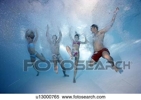 Group underwater in swimming pool View Large Photo Image Stock Photography - Group underwater in swimming pool. Fotosearch