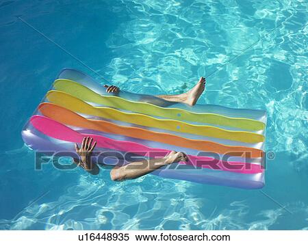 Man under pool inflatable View Large Photo Image Stock Photography - Man under pool inflatable. Fotosearch