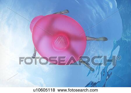 Underwater view of woman in pool View Large Photo Image Stock Photo - Underwater view of woman in pool. Fotosearch