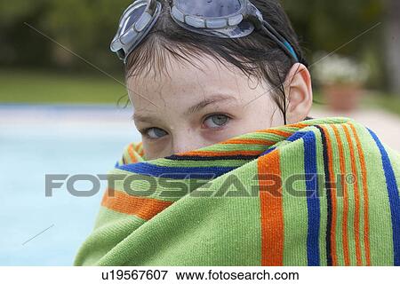 Young girl wrapped in a towel View Large Photo Image Stock Photo - Young girl wrapped in a towel. Fotosearch