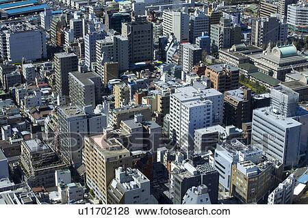 Stock Photo - Street lined with large buildings. Fotosearch
