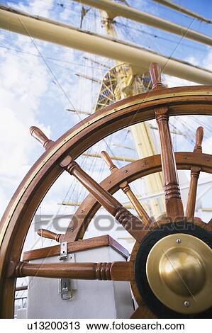 Stock Image - Close-up of the helm of a sailing ship. Fotosearch