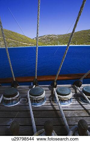 Ropes tied up with bollards in a boat View Large Photo Image Picture - Ropes tied up with bollards in a boat. Fotosearch