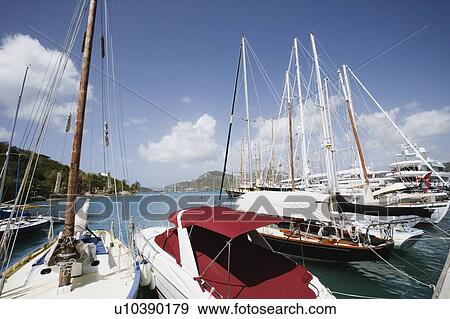 Stock Photo - Tourboats moored at a harbor. Fotosearch