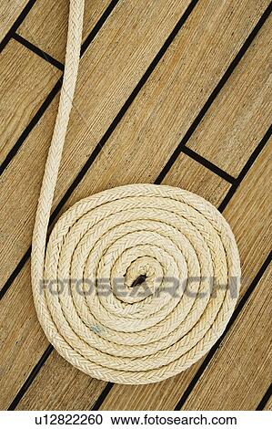 Close-up of a rope on the deck of a sailboat View Large Photo Image Stock Image - Close-up of a rope on the deck of a sailboat. Fotosearch